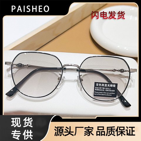 Silver and black round metal glasses with lightly tinted photochromic lenses