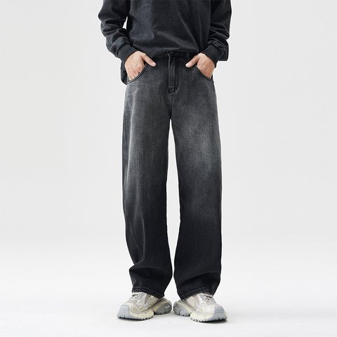 Model in washed black wide curved-leg jeans
